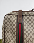 Valigia vintage Gucci realizzata in tela GG monogramma con dettagli in pelle marrone e strisce Web