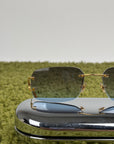 Occhiali da sole Rimless Cartier Eyewear Oro con lenti sfumate