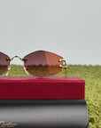 Occhiali da sole Geometrici Panthère de Cartier con lenti rosa e aste oro