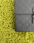 Pochette Louis Vuitton S-Lock in in pelle nera Monogram