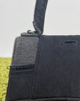 Borsa Balenciaga Hourglass Small in denim patchwork nero con logo B metallico argento