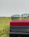 Occhiali da sole Cartier con aste oro