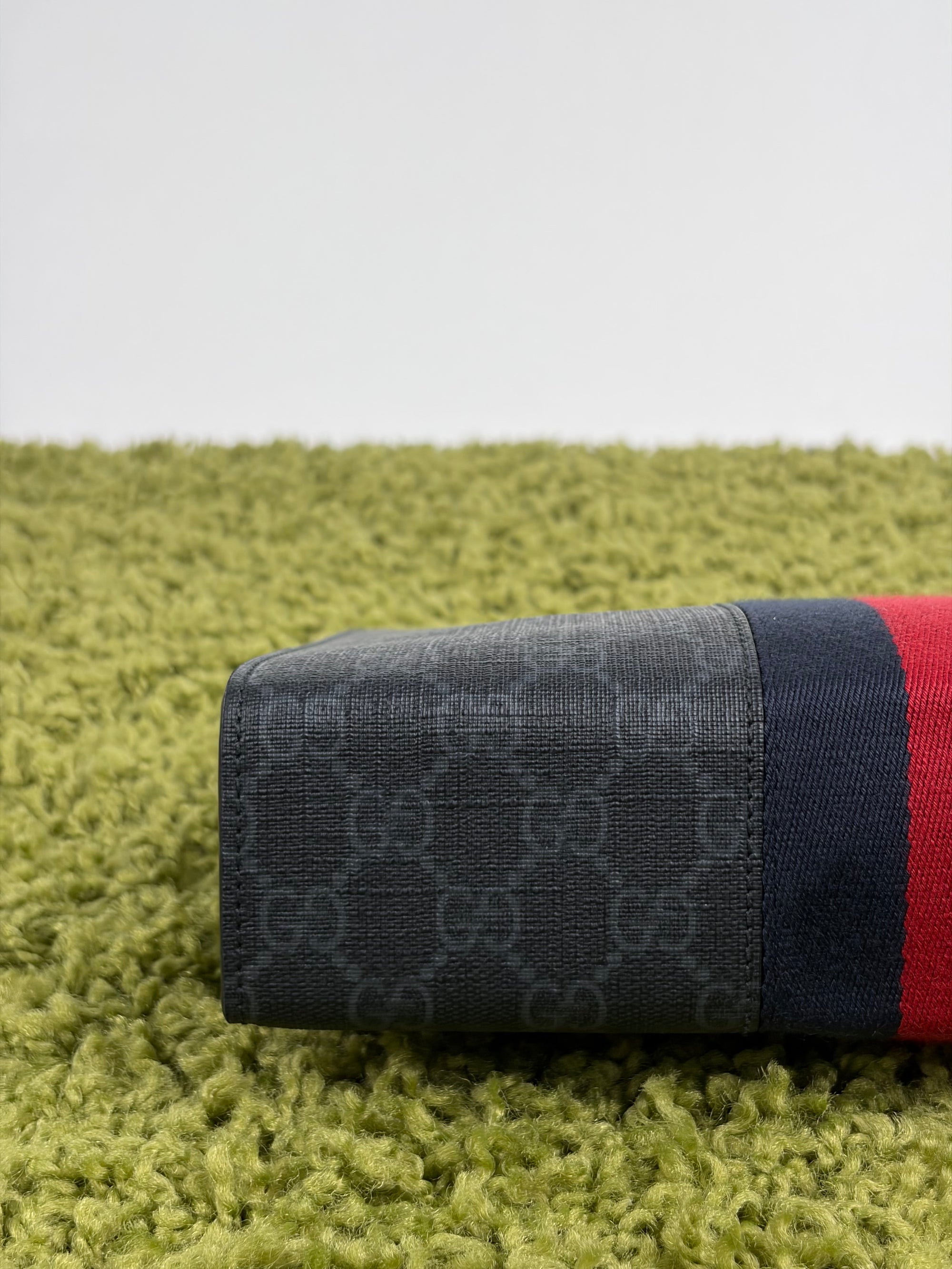 Pochette Gucci nera blu e rossa