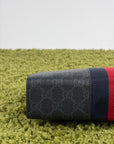 Pochette Gucci nera blu e rossa