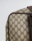 Valigia vintage Gucci realizzata in tela GG monogramma con dettagli in pelle marrone e strisce Web