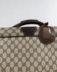 Valigia vintage Gucci realizzata in tela GG monogramma con dettagli in pelle marrone e strisce Web