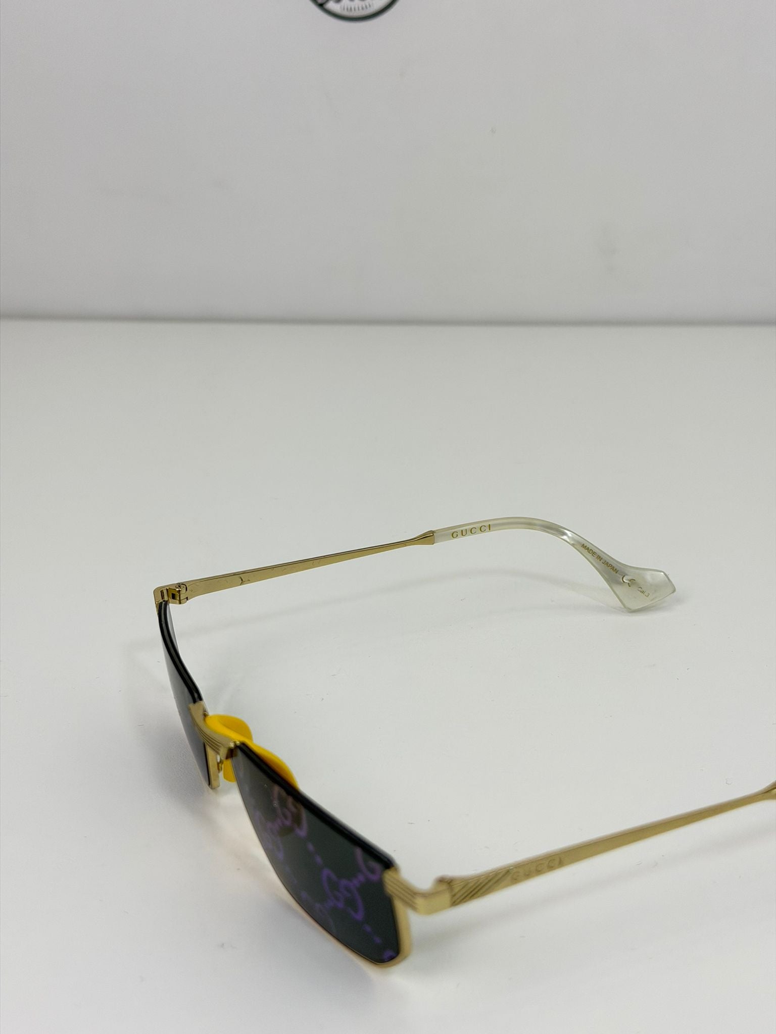 occhiali Gucci oro e multicolore