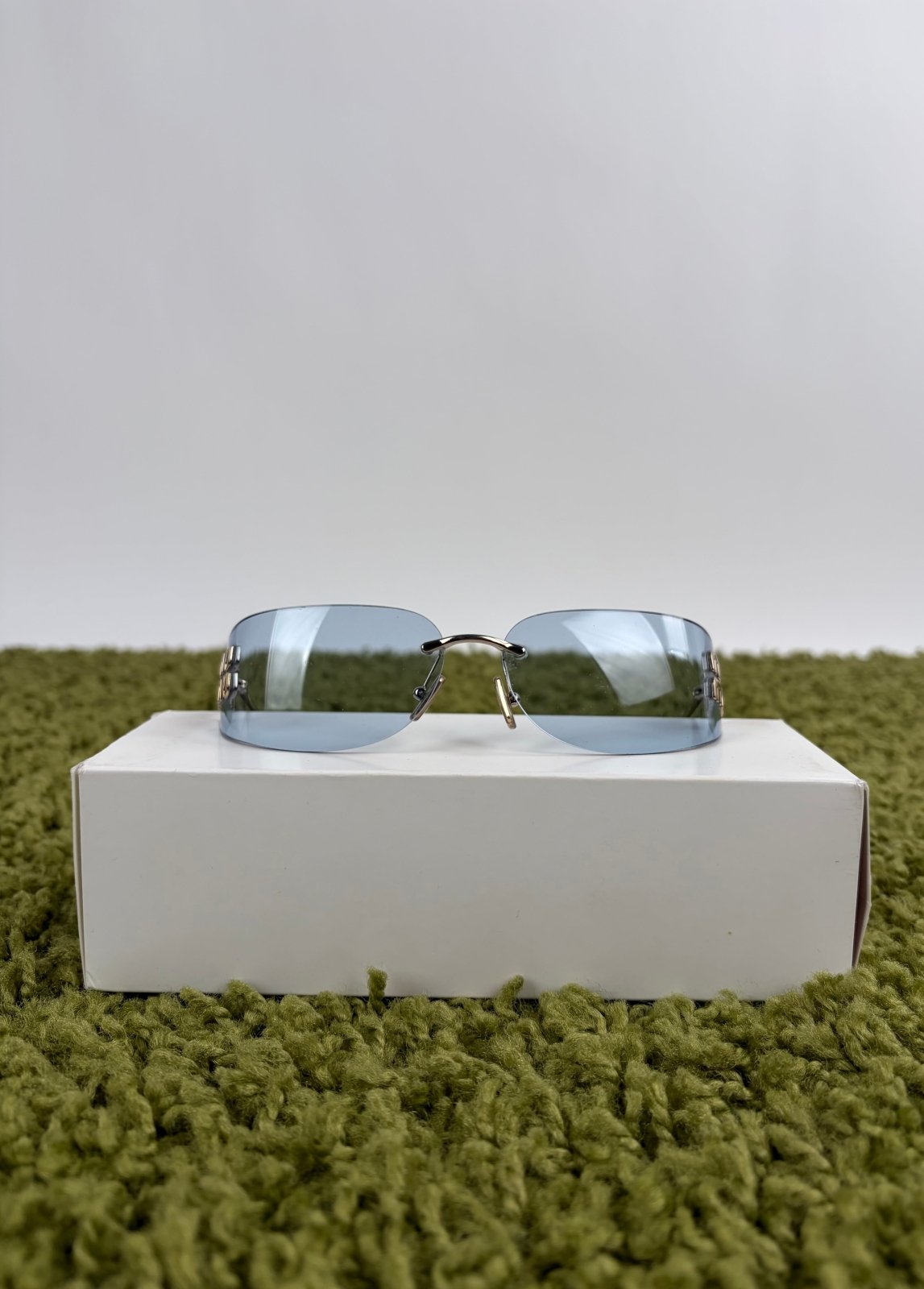 Occhiali da sole Miu Miu MU in oro pallido con lenti azzurre - Second Hand Di Fiore